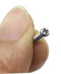 Hella Solid Mini Screw Kit For Eyeglass And Laptop Repair Packs Durable self-tapping screw held between fingers for easy repairs.