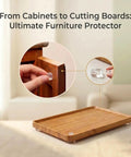 Image of a hand applying a half inch clear silicone bumper on a cabinet door with a bamboo tray underneath, showing 256 Piece Bulk Pack Clear Silicone Cabinet Door Bumpers Sticks Like Glue Half Inch Rubber Furniture Protectors Soft Close Pads To Keep Your Cabinets Chill And Quiet During Everyday Use.