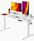 Rock Solid 60 X 24 Inch Electric Adjustable Standing Desk Featuring Smooth Motor Lift And Seamless One Piece Desktop For Heavy Duty Home Office Workspaces Designed For Maximum Comfort And Zero Hassle with dual monitors and accessories.