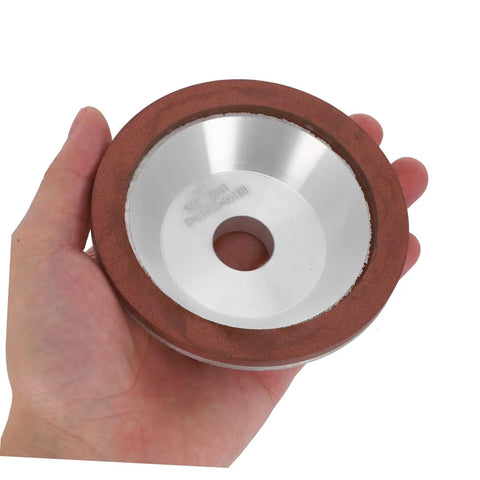 Diamond Cup Grinding Wheel Perfect For Metal And Stone Sharpening Tasks held in hand for easy demonstration of size and design.
