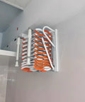 Electric Telescopic Attic Ladder With Hella Sturdy Forged Aluminum Frame Wall Mounted Retractable Folding Stairs Zero Clutter Design Orange fully retracted.