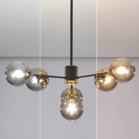 Six Light Glass Globe Sputnik Chandelier In Matte Black With Amber Shade, showcasing its modern design in a home interior setting.