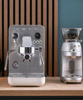 Semi Pro Home Espresso Machine With 15 Bar Pump Triple Thermoblock Heating 58mm Portafilter Steam Wand And Made In Italy Craftsmanship In White For True Barista Quality At Home on a kitchen counter