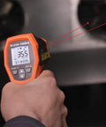 Infrared Thermometer Gun With Dual Laser Targeting For Easy Readouts And 20 To 1 Distance To Spot From Minus Forty To Twelve Hundred Fahrenheit And K Type Probe Built For Worksite Pro And Home Use in use with dual lasers targeting.