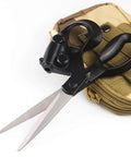 Front view of professional laser-guided fabric scissors with ergonomic black handle and magnetic storage