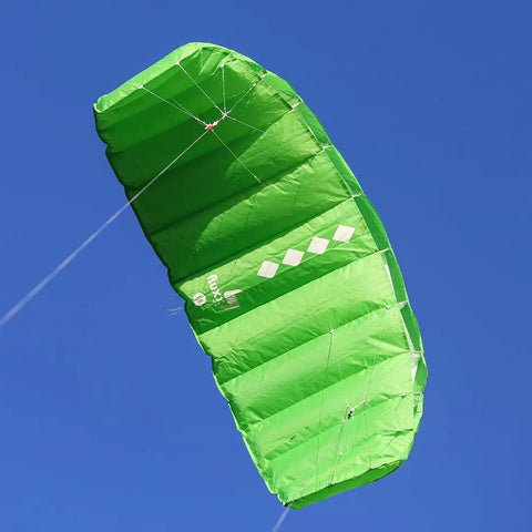 Green Fluxx 1.8 R2F Trainer Kite for Beginners with attached lines, designed for stable flight and easy setup in clear blue sky