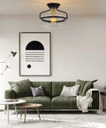 Room with Seeded Glass Semi Flush Mount Ceiling Light In Matte Black, 11.2 Inch Shade, above green sofa and modern decor.