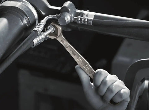 Mechanic using Joker SB Ratcheting Combination Wrench 10 mm With Double Hex Slip Preventing Jaw Metal Jaw Plate on bike