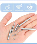 Top Shelf 110 Pack Stainless Steel Shelf Pins For Cabinets And Furniture Solid Grip With Smooth Nickel Finish Rust Resistant Dowel Pegs Built Tough To Handle held in a hand.