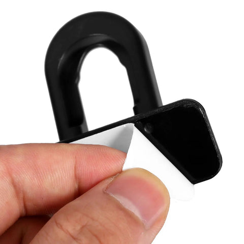 Close-up of adhesive backing on 4 Pack Of Kid Safe Safety Locks For Refrigerator And Oven Cabinets Plastic Latches.