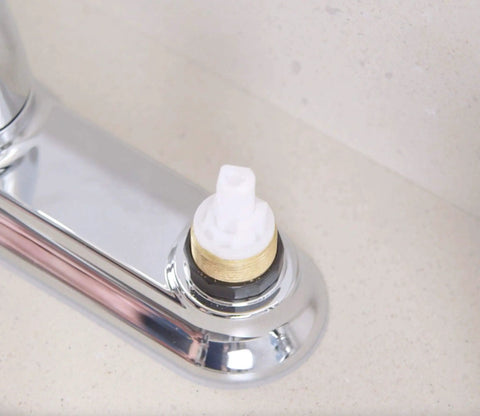 Close-up of 1224 Replacement Faucet Cartridge Kit For Double Handle Faucets And Tub Showers, Fits Moen, installed in chrome fixture