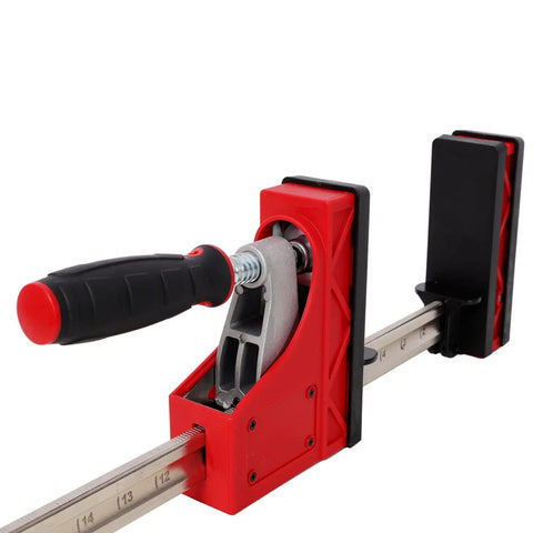 Close-up of red handle and clamping mechanism of Parallel Clamp Kit Tools Set With Bench Dogs And Blocks 24 Inch and 40 Inch Clamps