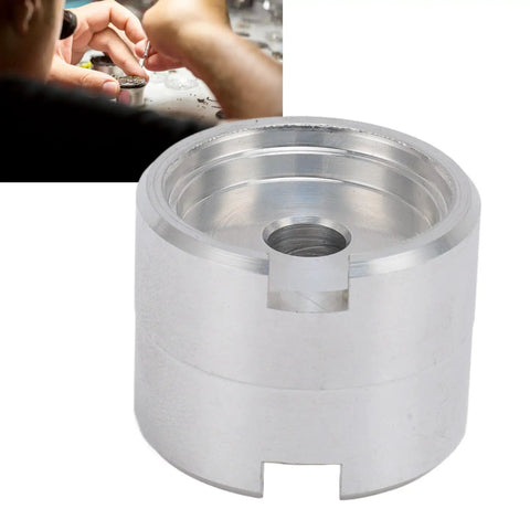 Close-up of Pro Grade Aluminum Watch Movement Holder For 2824 2892 NH35 NH36 2813 8200 with watchmaker in background