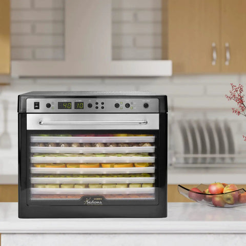 No Sweat Electric Food Dehydrator With Digital Temperature Control And Smart Timer, displaying snacks and herbs in BPA-free trays.
