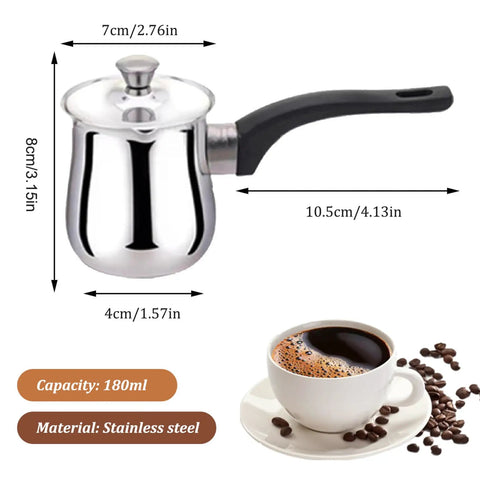 Turkish Coffee Pot 180ml Stainless Steel With Anti Scalding Handle And Lid next to a cup of coffee and coffee beans.