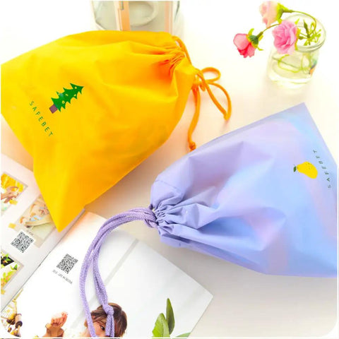 Waterproof Drawstring Storage Bags Set Of Five Made From PE Plastic Great For Travel Gym Swim Gear And Laundry Organization Quick Access And Easy Packing For Home Or On The Go, yellow and purple bags displayed on table