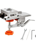 Front view of 35mm hinge boring jig for woodworking; silver metal drill guide with orange knob and included wrench