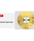 Gold base of Tempered Glass Lazy Susan With Swivel Assist System, featuring intricate design and central metallic disc.