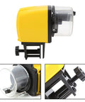 Dead Simple Automatic Fish Feeder With Battery Powered Digital Timer And Sleek LCD Panel in yellow with adjustable clamp.