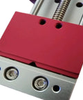 Close-up of Solid Mini Bench Vise With Dual Shape Jaw for clamping PCB Phone Motherboards and cylindrical components on CNC drill presses.