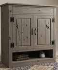Chill Coastal Beachwood Water Based Wood Stain Zero VOC For Interior And Exterior Use Features A No Sweat Brush On Formula With Reactive Tannin Popping Delivers A Totally Fresh Sun Washed Finish In A Massive Five Gallon Drum on a rustic cabinet with black hardware.