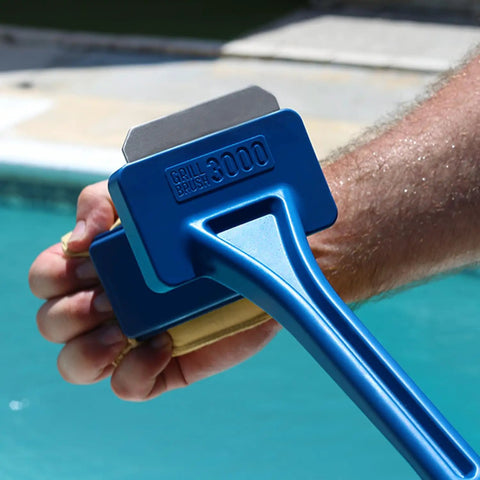 Person holding Bristle Free Grill Scraper Head Replaceable Cleaning Tool For Cast Iron And Stainless Steel Grates Safe Durable BBQ Cleaner 2 In 1 Grate Scraper No Bristles No Worries Easy To Replace near a pool.