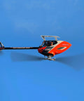 Ready To Fly Pro Grade RC Helicopter With Dual Brushless Motors Direct Drive 6CH Remote in flight against blue sky