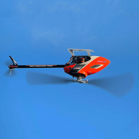 Ready To Fly Pro Grade RC Helicopter With Dual Brushless Motors Direct Drive 6CH Remote in flight against blue sky