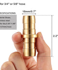 Brass Garden Hose Repair Connector With Clamps Fits Three Fourth Inch Or Five Eighth Inch Hoses held in hand showing size.