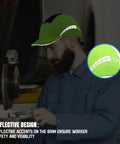 Mechanic wearing Lightweight Bump Cap With Breathable Baseball Cap Style For Work Hard Hat Alternative in lime green with ABS liner.