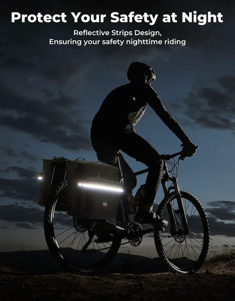 Cyclist with 34L Waterproof Bike Pannier Bag With Rain Cover For Rear Rack in low light, reflective strips visible, ensuring safety.