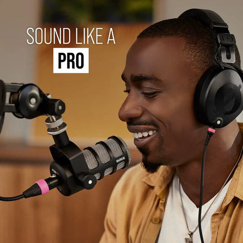 Person using PodMic Cardioid Dynamic Broadcast Microphone with XLR output for studio podcasts and live streaming, not USB plug in.