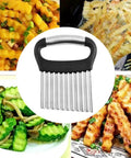 Front view of black-handled stainless steel crinkle cutter with wavy blade for potatoes, cucumbers, carrots.
