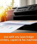 Top Notch Multipurpose Copy Paper 20 Lb 11 X 17 Inches Tabloid Size printing from a laser printer in a bright office.