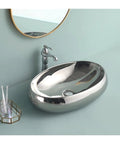 USZWBY Bathroom Vessel Sink European Ceramic Sink Art Basin Chrome Wash Basin Oval Sink Bathroom Sink Washbasin Above Counter Basin with Faucet,Silver Bathro in polished chrome finish, elegant shape.