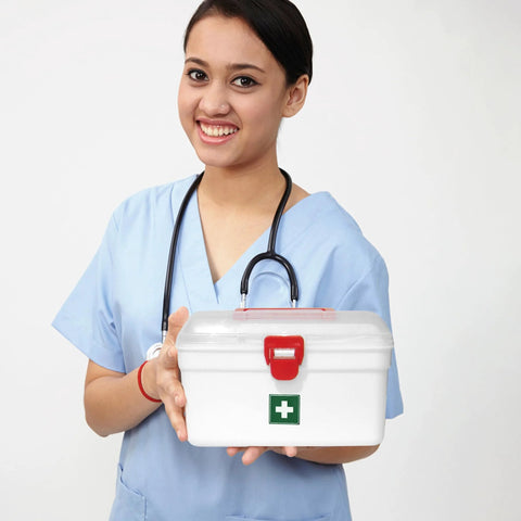 Milton white plastic first aid box, front view with red latch and green cross logo held by nurse