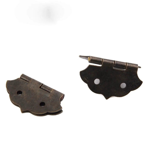 Close-up of Antique Bronze Flower Pattern Hinges For Small Cabinets And Wooden Boxes, Decorative Butt Hinge With 4-Hole Mount, screws not shown.