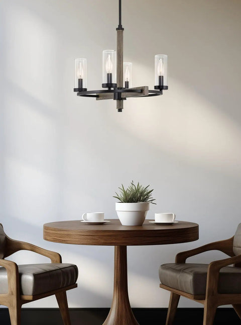 Alden 18 Inch 4 Light Modern Farmhouse Chandelier with clear glass shades, gray oak wood finish, and black accents over table.