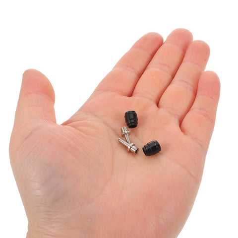 Hand holding 4 Piece Quick Release Hydraulic Brake Hose Olive Connector Inserts for Bicycle Disc Brakes Aluminum Alloy