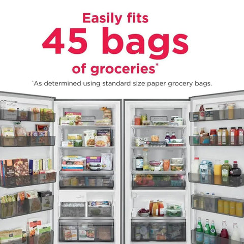 Sleek Smudge Proof Stainless Steel Upright Freezer With 18.9 Cubic Feet Storage And Smooth Glide Out Ice Maker Powered By Straight Up Reliable EvenTemp Cooling filled with groceries.