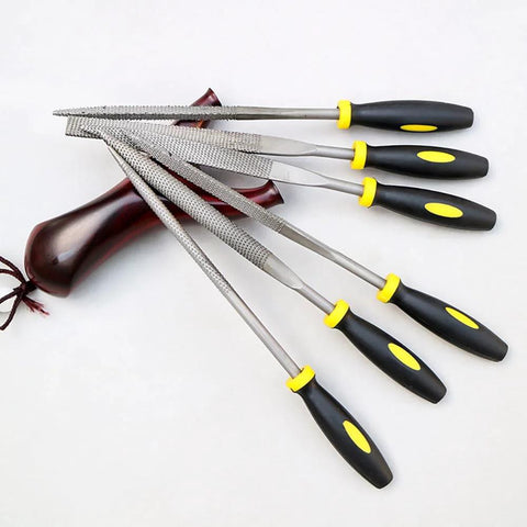 Six 140mm metal rasp needle files with black handles and yellow accents.