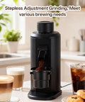 Badass Single Dose Electric Coffee Grinder Featuring Rock Solid 80 Millimeter Flat Burrs And Tweakable Stepless Adjustment For Hella Smooth Flavor Extraction And Minimal Static Residue Always Ready To Serve Black on kitchen counter with brewed coffee
