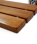 Close-up of Heavy Duty 20 Inch Teak Wood Folding Shower Seat showing teak slats and chrome hardware, wall mounted bath stool.