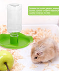 Automatic Reptile Water Feeder For Lizards Turtles And Geckos Tank Gravity Self Filling Bowl on green base with clear water bottle.