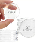 Heavy Duty Silicone Door Stoppers For Wall Peel And Stick Quick Pick Up These Solid Sets To Kick Handle Dents Spare Drywall Paint Mute Room Noise Keep Houses Snazzy No Hassle, showing 2" diameter clear rubber pads in a hand.