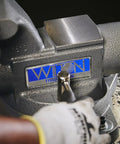 Beefy Pro Grade Bench Vise 4-1/2 Inch Jaw, 3-1/2 Inch Opening, 3-1/4 Inch Throat, 60,000 PSI Ductile Iron Body With Enclosed Lubrication, Heavy-Duty Anvil For Rugged Metalworking And Smooth, Long Lasting Operation on workbench