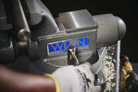 Beefy Pro Grade Bench Vise 4-1/2 Inch Jaw, 3-1/2 Inch Opening, 3-1/4 Inch Throat, 60,000 PSI Ductile Iron Body With Enclosed Lubrication, Heavy-Duty Anvil For Rugged Metalworking And Smooth, Long Lasting Operation on workbench