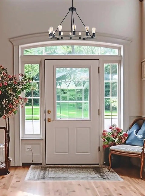 Homestead 25 Inch Six Light Wagon Wheel Chandelier With Gray Oak Wood Finish And Textured Black Accents in foyer view