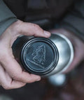 Person holding lid of Stainless Steel Canteen Cooking Set For Survival Camping Nestable Mess Kit Open Fire Ready Military Grade Outdoor Eating Kit
