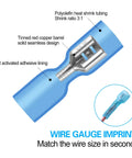 Close-up of blue 100 Pack Waterproof Heat Shrink Female Spade Connectors 16 To 14 AWG, showing tinned copper interior and adhesive lining.